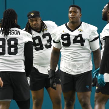 Jacksonville Jaguars defensive tackle Jordan Jefferson (98), defensive end Tyler Lacy (93), defensive tackle Maason Smith (94), defensive end Esezi Otomewo (90) and defensive tackle DaVon Hamilton (52) line up for drills. The Jacksonville Jaguars let most of the veterans off from participating in Monday's mandatory minicamp session held in the air conditioned enclosed field at EverBank Stadium's Miller Electric Center in Jacksonville, Fla. June 10, 2024. [Bob Self/Florida Times-Union]