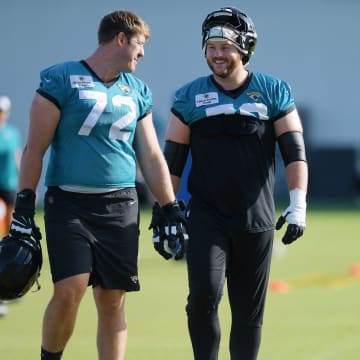 Jacksonville Jaguars offensive tackle Walker Little (72), center Luke Fortner (79) and guard Ezra Cleveland (76) walk onto the field at the start of the fourth day of the NFL football training camp practice session Saturday, July 27, 2024 at EverBank Stadium's Miller Electric Center in Jacksonville, Fla. [Bob Self/Florida Times-Union]