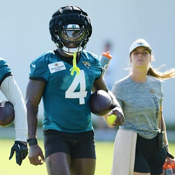 Jacksonville Jaguars running back Travis Etienne Jr. (1) and running back Tank Bigsby (4) walk together during the fourth day of the NFL football training camp practice session Saturday, July 27, 2024 at EverBank Stadium's Miller Electric Center in Jacksonville, Fla. [Bob Self/Florida Times-Union]