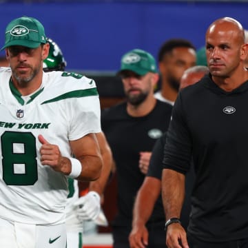 Aug 26, 2023; East Rutherford, New Jersey, USA; New York Jets quarterback Aaron Rodgers (8) and head coach Robert Saleh leave the field after the first half of their game against the New York Giants at MetLife Stadium. 
