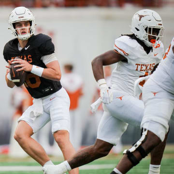 Texas Longhorns quarter back Arch Manning (6) looks for a pass during the Longhorns' spring Orange and White game at Darrell K Royal Texas Memorial Stadium in Austin, Texas, April 20, 2024.