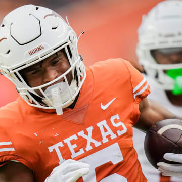 Texas Orange team wide receiver Ryan Wingo (5) runs the ball in for a touchdown during the Longhorns' spring Orange and White game at Darrell K Royal Texas Memorial Stadium in Austin, Texas, April 20, 2024.