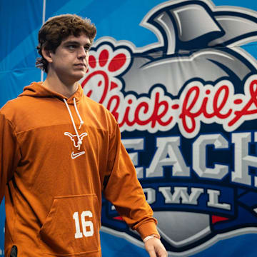 Texas Longhorns quarterback Arch Manning (16) walks onto the field as the Texas Longhorns prepare to play the Arizona State Sun Devils in the Peach Bowl College Football Playoff quarterfinal at Mercedes-Benz Stadium in Atlanta, Georgia, Jan. 1, 2025.