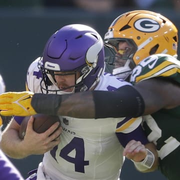 Green Bay Packers defensive end Rashan Gary (52) sacks Minnesota Vikings quarterback Sam Darnold.