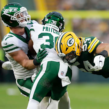 Green Bay Packers linebacker Kristian Welch (54) tackles New York Jets wide receiver Jamaal Pritchett (36)during their football game on Saturday, August 9, 2025, at Lambeau Field in Green Bay, Wis.