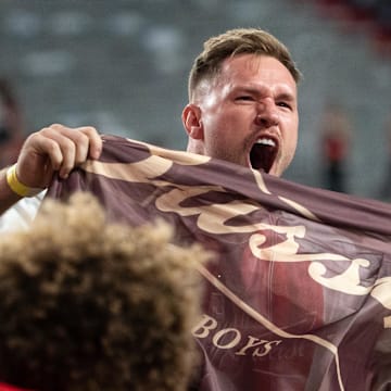 Oct 9, 2021; Lincoln, Nebraska, USA; Former Nebraska Cornhuskers and NFL linebacker Will Compton pumps up the crowd during the second quarter at Memorial Stadium. Mandatory Credit: Dylan Widger-Imagn Images