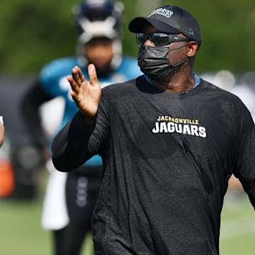 Jaguars offensive line coach George Warhop wears a mask as he instructs his players. The Jacksonville Jaguars training camp session, Wednesday, July 28, 2021, at the team's practice fields outside TIAA Bank Field. [Bob Self/Florida Times-Union]

Jki 072821 Jagstrainingcam 5