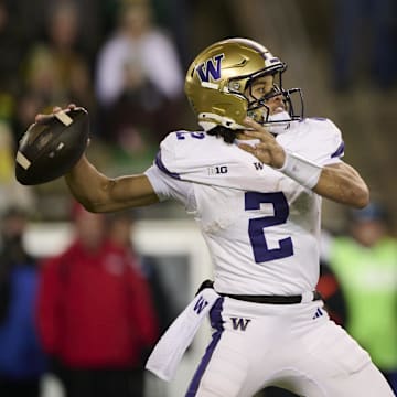 Nov 30, 2024; Eugene, Oregon, USA; Washington Huskies quarterback Demond Williams Jr. (2) throws a pass during the first half against the Oregon Ducks at Autzen Stadium. Mandatory Credit: Troy Wayrynen-Imagn Images