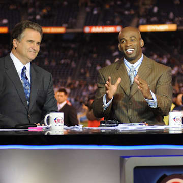 Steve Mariucci, Deion Sanders, and Marshall Faulk of the NFL Network at game between the Oakland Raiders and the San Diego Chargers at Qualcomm Stadium.