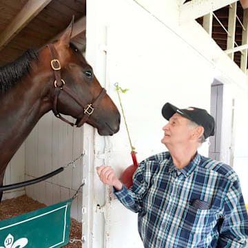 Wearing his trademark plaid shirt, Briley poses with Coal Battle—his $70,000 long shot colt and ticket to the sport’s biggest stage.