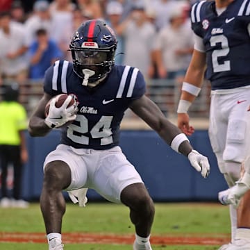 Aug 31, 2024; Oxford, Mississippi, USA; Mississippi Rebels running back Ulysses Bentley IV (24) runs the ball during the first half against the Furman Paladins at Vaught-Hemingway Stadium. Mandatory Credit: Petre Thomas-Imagn Images