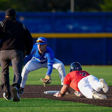 Memphis' Creek Robertson (1) prepares to tag out Ole Miss' Luke Hill (7) as he slides into second base during the game between Ole Miss and the University of Memphis at FedExPark in Memphis, Tenn., on Tuesday, April 8, 2025.