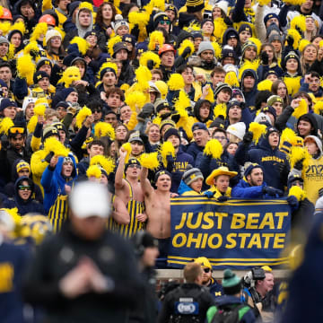 Nov 25, 2023; Ann Arbor, Michigan, USA; Michigan Wolverines fans cheer during the second half of the NCAA football game against the Ohio State Buckeyes at Michigan Stadium. Ohio State lost 30-24.