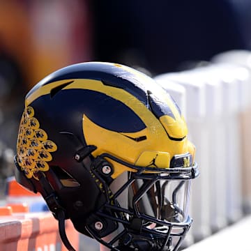 Oct 12, 2019; Champaign, IL, USA; A Michigan Wolverines helmet sits on the back of the bench during the second half of the game against the Illinois Fighting Illini at Memorial Stadium. Mandatory Credit: Michael Allio-Imagn Images