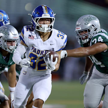 Serra senior running back Chris Yoon races through a big hole during Friday's 39-10 loss at De La Salle