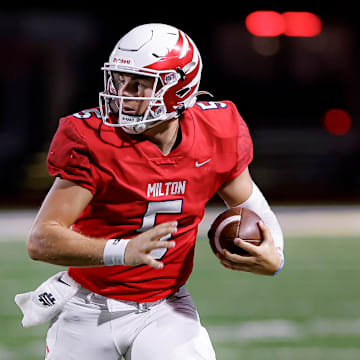 Milton senior quarterback Luke Nickel threw for 413 yards and four touchdowns in their state championship win against Langston Hughes Tuesday night. 