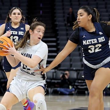 Izzy McFadden (left) of Marin Catholic is guarded by Mater Dei Catholic's Ana Karen Lacave during the California (CIF) State Division 3 title game.