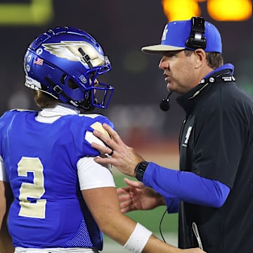Carson Palmer (right) talks to Santa Margarita QB Trace Johnson during the CIF State Open Division final against De La Salle at Saddleback College.