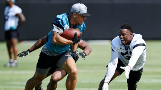 Jacksonville Jaguars running back Jalen Jackson (36) and linebacker Ventrell Miller (51) try to defend against wide receiver Parker Washington (11) special teams drills at the organized team activity session Monday, June 3, 2024 at EverBank StadiumÕs Miller Electric Center in Jacksonville, Fla. [Bob Self/Florida Times-Union]