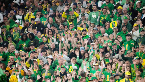 Oregon Ducks fans celebrate after a touchdown against the Liberty Flames in the second half during the Fiesta Bowl