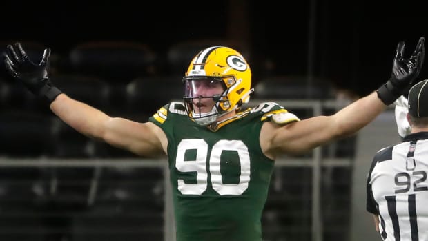 reen Bay Packers linebacker Lukas Van Ness (90) reacts against the Dallas Cowboys during the fourth quarter of their wild car