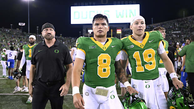 Sep 7, 2024; Eugene, Oregon, USA; Oregon Ducks quarterback Dillon Gabriel (8) and quarterback Ryder Hayes (19) walk off the f