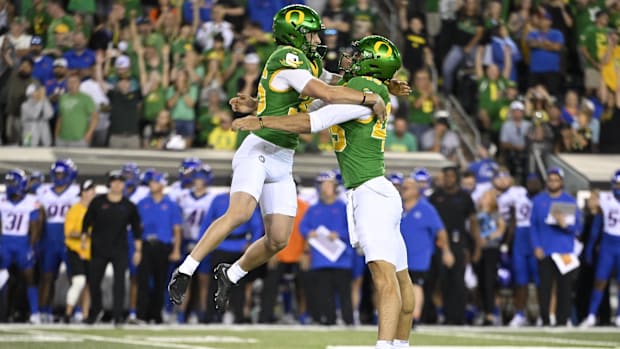 Atticus Sappington (36), left, celebrates with punter Luke Dunne (45) after kicking the game winning goal during the second h