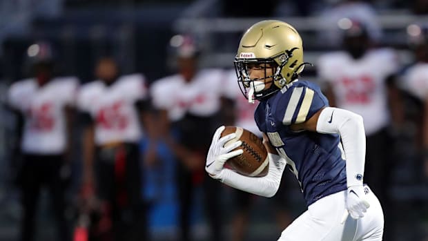 Hoban's Elbert Hill IV returns a first-half kick 92 yards for a touchdown against Glenville, Friday, Oct. 6, 2023.