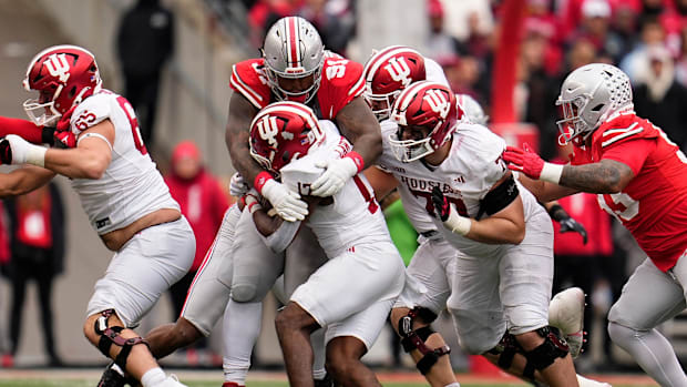 Ohio State Buckeyes defensive tackle Tyleik Williams (91) tackles Indiana Hoosiers running back Ty Son Lawton (17) during the