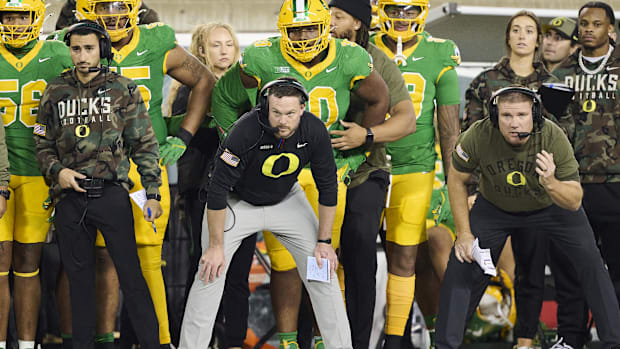 Oregon Ducks head coach Dan Lanning, center, watches the defense during the second half against the Maryland Terrapins at Aut