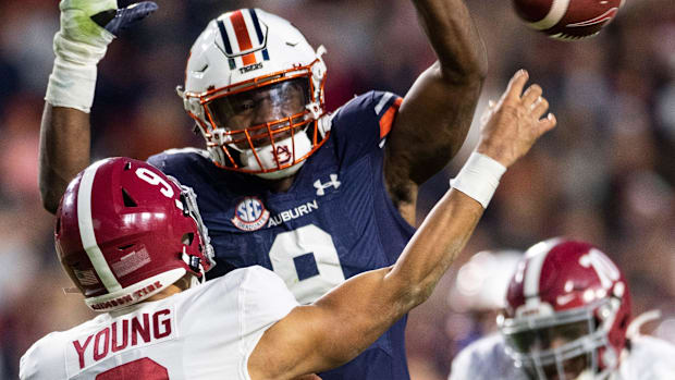 Auburn Tigers linebacker Zakoby McClain (9) pressures Alabama Crimson Tide quarterback Bryce Young (9)