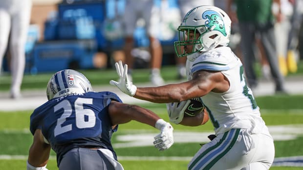 Oct 28, 2023; Houston, Texas, USA; Tulane Green Wave running back Makhi Hughes (21) stiff arms Rice Owls safety Gabriel Taylo
