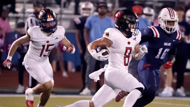 Ravenwood's wide receiver Ben Hubbard (8) carries the ball during the football game against Oakland at Oakland on Friday, Oct