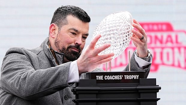 Ohio State head coach Ryan Day with the national championship troph