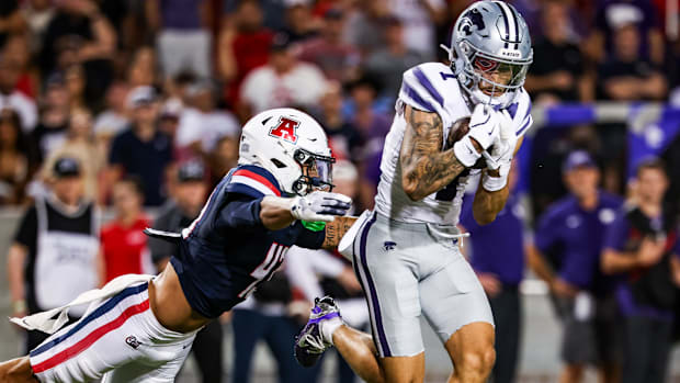 Kansas State wide receiver Jayce Brown makes a catch while defended by Arizona defensive back Dalton Johnson. Kansas State wide receiver Jayce Brown makes a catch while defended by Arizona defensive back Dalton Johnson.