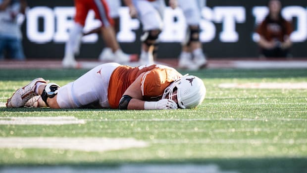 Jake Majors lies on the turf after suffering an injur