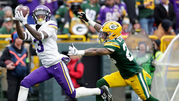 Minnesota Vikings receiver Jordan Addison (3) catches a pass against Green Bay Packers cornerback Jaire Alexander in 2023.
