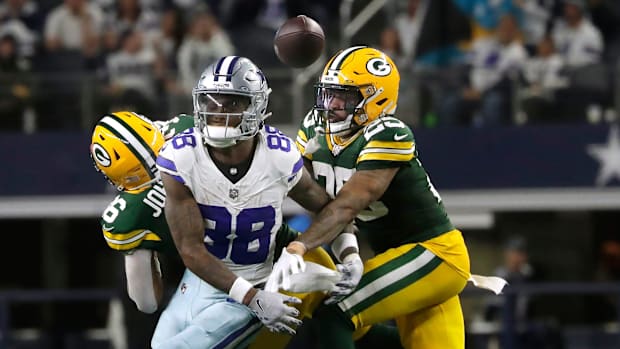 Green Bay Packers cornerback Keisean Nixon (25) helps break up a pass intended for Cowboys receiver CeeDee Lamb.
