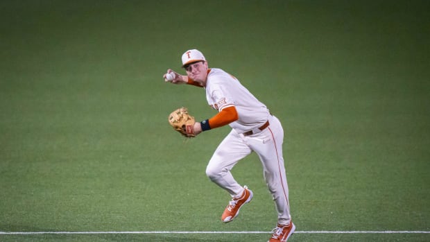 Texas infielder Jalin Flores (1) throws the ball to first base in the second inning of the