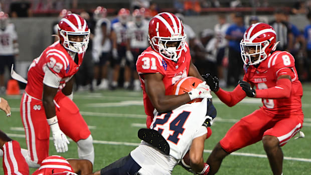 Mater Dei defense swarms the Bishop Gorman ball carrier on Friday, Sept. 6, 2024.