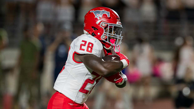 North Shore's D'Andre Hardeman takes a handoff in a nationally ranked rivalry game against Atascocita on Oct. 25, 2024. 