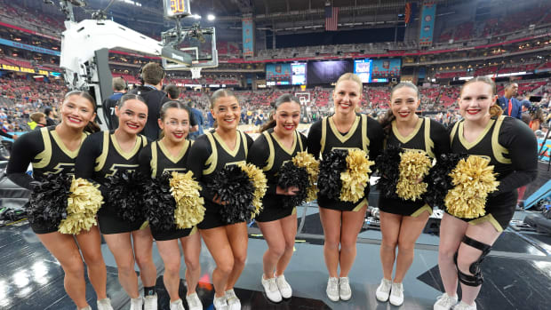 Purdue Boilermakers cheerleaders pose for a photo before the national championship game of the Final Four of the 2024 NCAA Tournament between the Connecticut Huskies and the Purdue Boilermakers at State Farm Stadium.