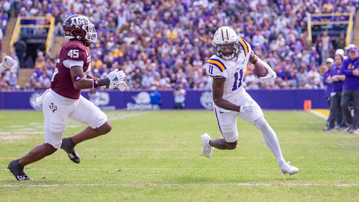Brian Thomas Jr 11 runs the ball as the LSU Tigers take on Texas A&M in Tiger Stadium in Baton