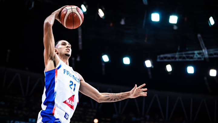 Hawks Forward Zaccharie Risacher scoring the ball against Iceland during a group phase match in the 2025 EuroBasket.