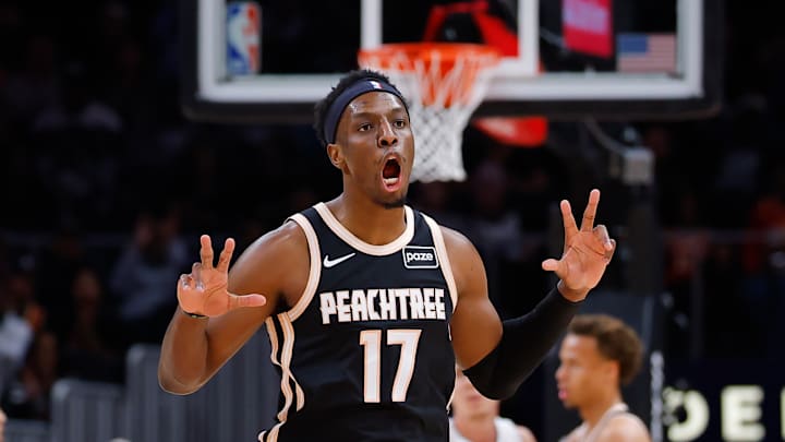 Onyeka Okongwu celebrates with two three point celebrations after knocking down a triple against the Detroit Pistons.