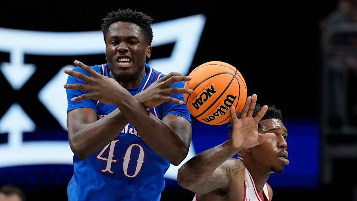 Kansas basketball player Flory Bidunga (left)