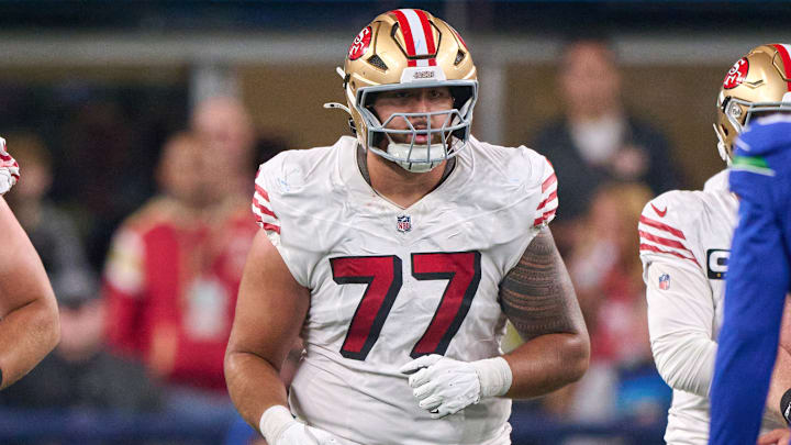 San Francisco 49ers offensive lineman Dominick Puni (77)