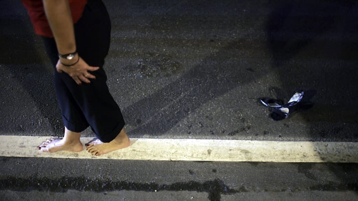 A woman completes a sobriety test