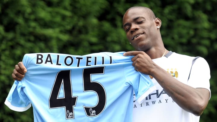 Italian footballer Mario Balotelli poses