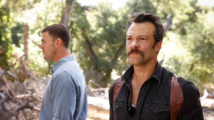 “The Funky Bunch” – NCIS: Origins. Pictured (L-R): Austin Stowell as Leroy Jethro Gibbs and Kyle Schmid as Mike Franks. Photo: Sonja Flemming/CBS ©2025 CBS Broadcasting, Inc. All Rights Reserved.